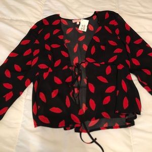 Sheer black blouse with red lips